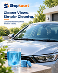 A silver car parked outdoors with a glass of blue liquid and two blue cleaning tablets in the foreground. Large text at the top reads 'Shopkaart Clearer Views.